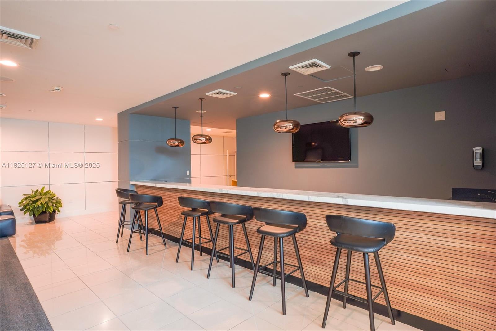 1250 South Miami Avenue, Unit 3003 Miami, FL 33130 - Photo 31 of 31 a kitchen with a table and chairs in it