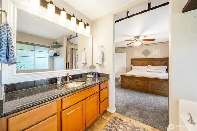 a bathroom with a double vanity sink and mirror