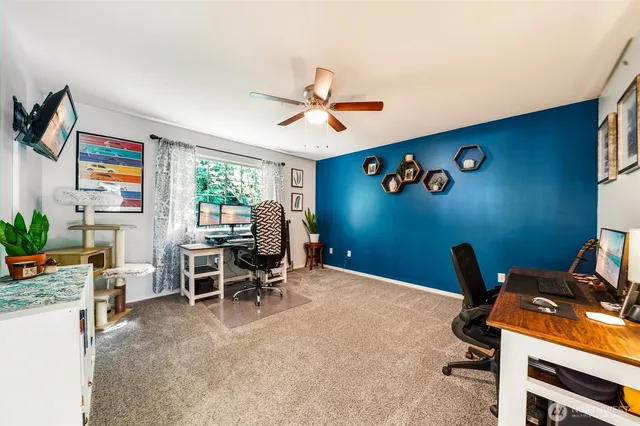 a workspace with furniture and a window