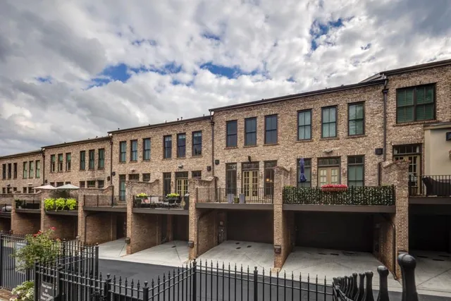 a view of a patio with table and chairs and potted plants