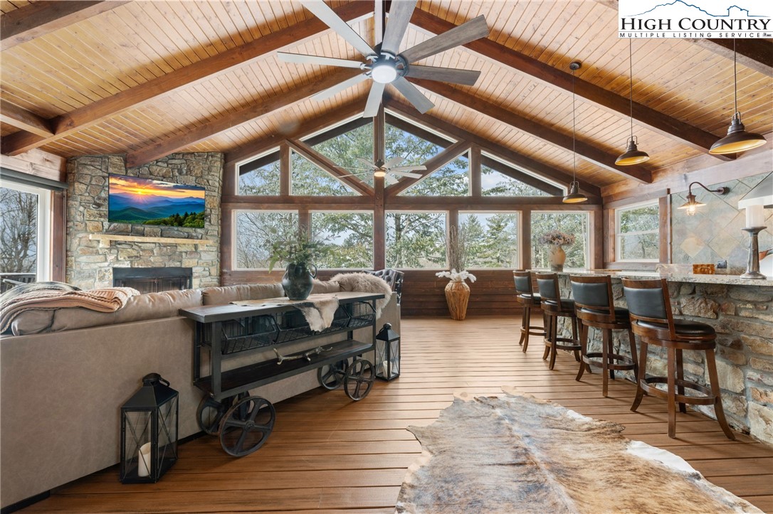 123 St Andrews Road Beech Mountain, NC 28604 - Photo 1 of 47 a living room with lots of furniture and a large window