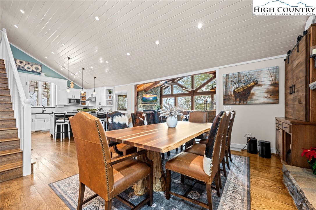 123 St Andrews Road Beech Mountain, NC 28604 - Photo 5 of 47 a dining room with furniture and wooden floor