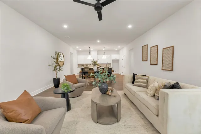 a dining room with furniture and wooden floor