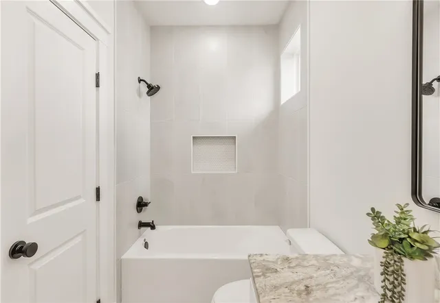 a bathroom with a sink vanity and a mirror
