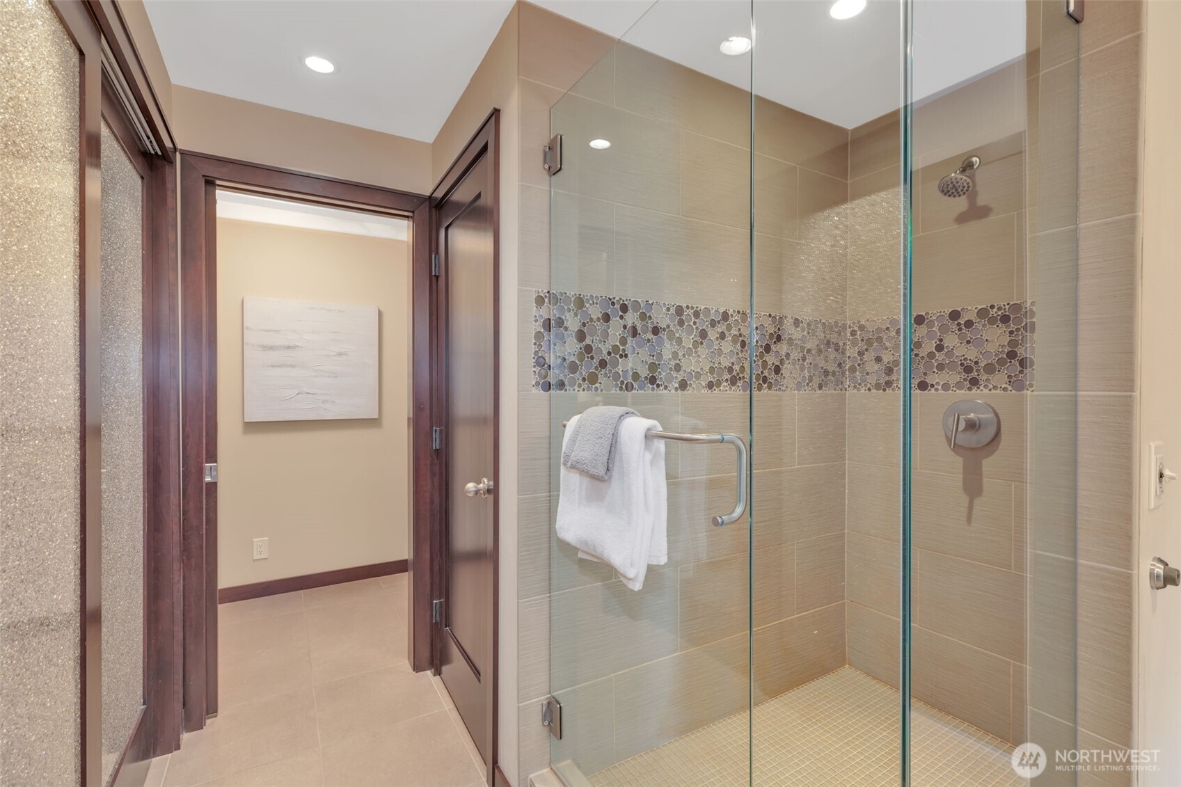 1231 5th Avenue North, Unit 101 Seattle, WA 98109 - Photo 15 of 31 a bathroom with a shower and a sink