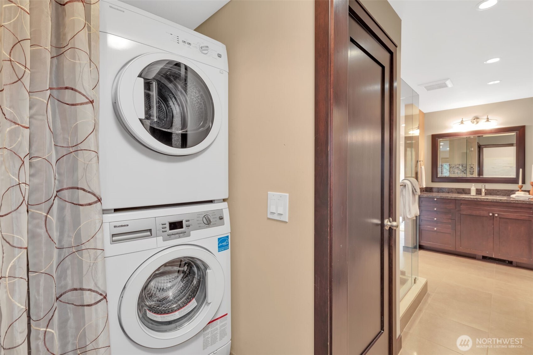 1231 5th Avenue North, Unit 101 Seattle, WA 98109 - Photo 19 of 31 a view of a hallway with washer and dryer