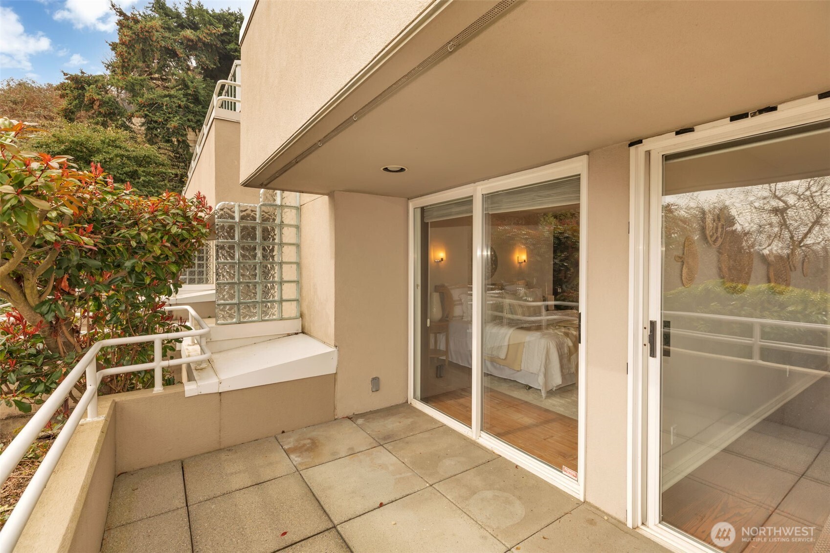 1231 5th Avenue North, Unit 101 Seattle, WA 98109 - Photo 27 of 31 a view of a balcony with table and chairs