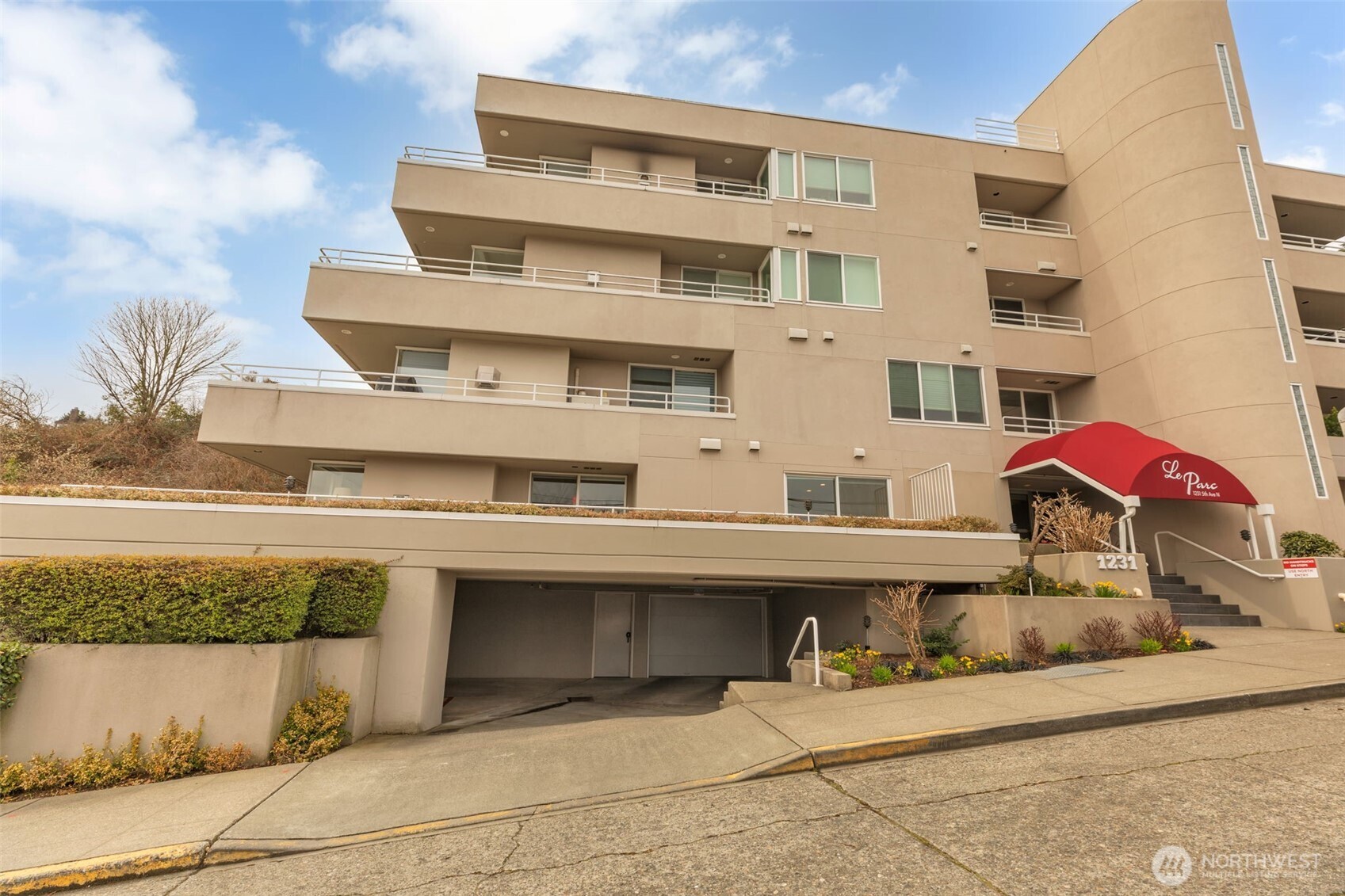 1231 5th Avenue North, Unit 101 Seattle, WA 98109 - Photo 30 of 31 a front view of a building with outdoor seating