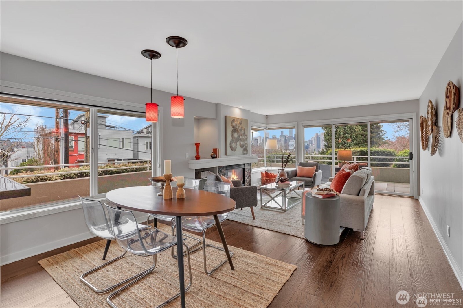 1231 5th Avenue North, Unit 101 Seattle, WA 98109 - Photo 7 of 31 a dining room with furniture a chandelier and wooden floor