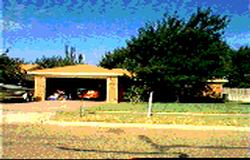 a view of a swimming pool with a yard