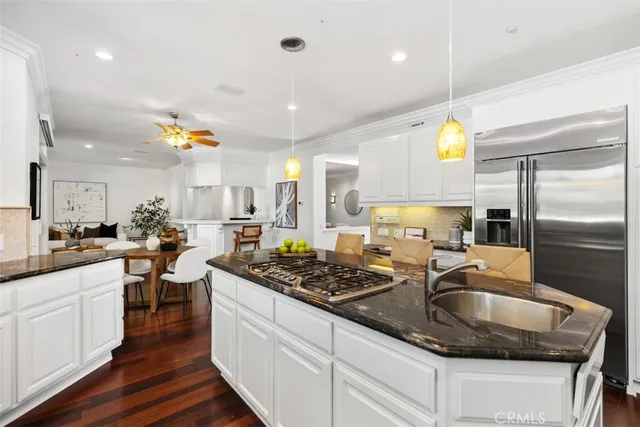 a kitchen with lots of counter top space and stainless steel appliances