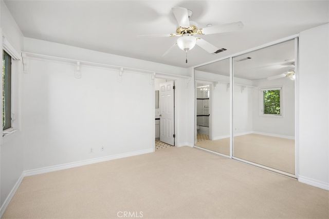 a view of an empty room with a glass door