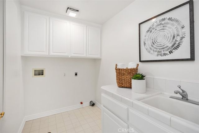 a spacious bedroom with a bed and a fireplace