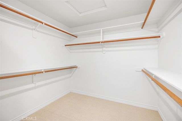 a view of a patio with furniture and umbrella