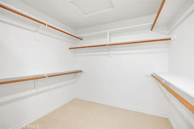 a view of a patio with furniture and umbrella