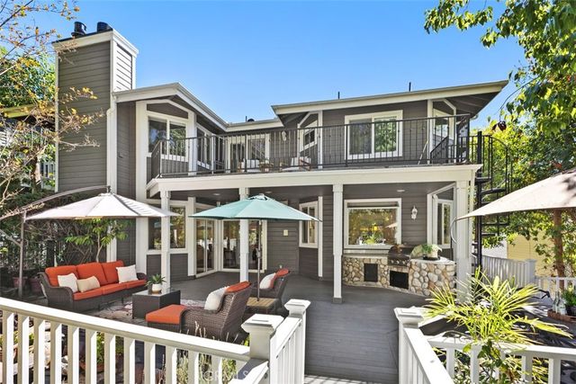 a view of a green field with wooden fence
