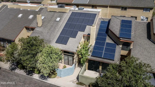 an aerial view of residential houses with wooden stairs