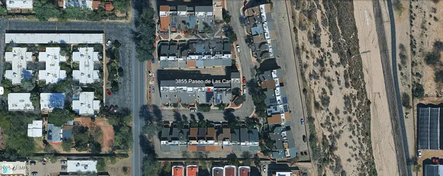 a en suite bathroom with a double vanity sink a mirror and a bathtub