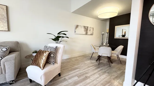 a living room with furniture and a potted plant