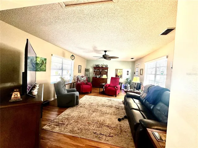 a living room with furniture or couch and a flat screen tv
