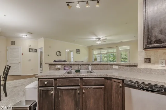 a kitchen with a sink cabinets and window