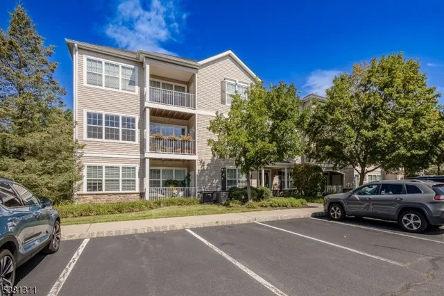 a view of a car parked in front of a building
