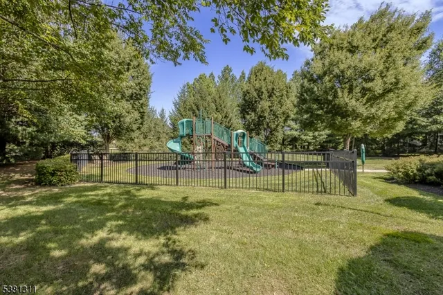 a garden with trees in the background