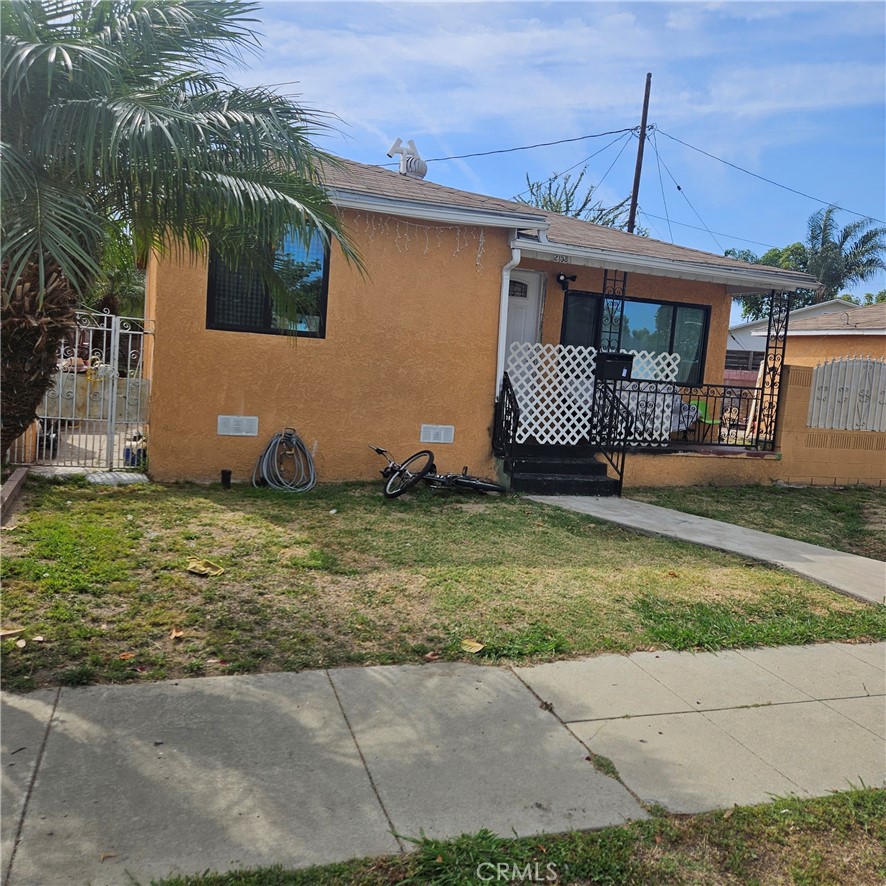 2153 Fitzgerald Avenue Commerce, CA 90040 - Photo 2 of 9 a front view of a house with garden