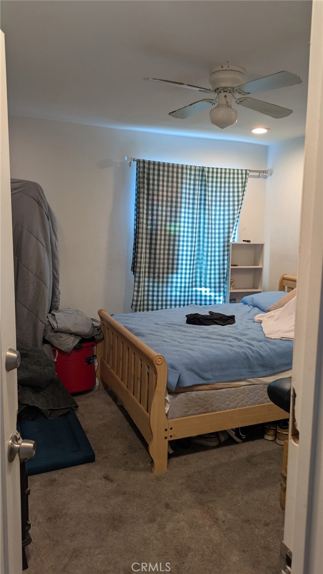 2153 Fitzgerald Avenue Commerce, CA 90040 - Photo 6 of 9 a bedroom with bed and a window