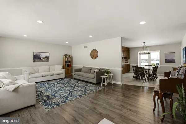 a kitchen with granite countertop a sink and cabinets