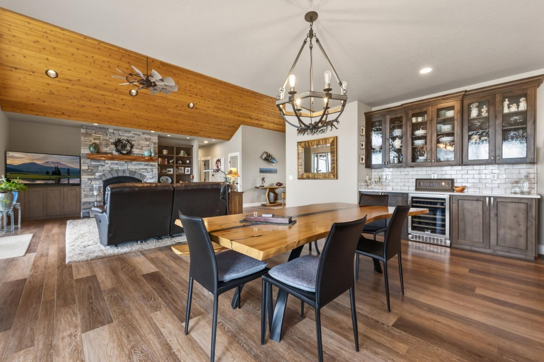 11620 Southwest Pixie Lane Culver, OR 97734 - Photo 10 of 53 a view of a dining room with furniture a chandelier and wooden floor