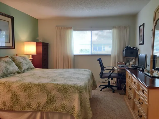 a room with a sink a toilet and a mirror