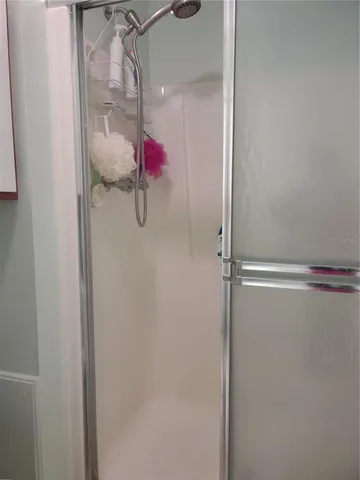 a living room with furniture a lamp and a chandelier