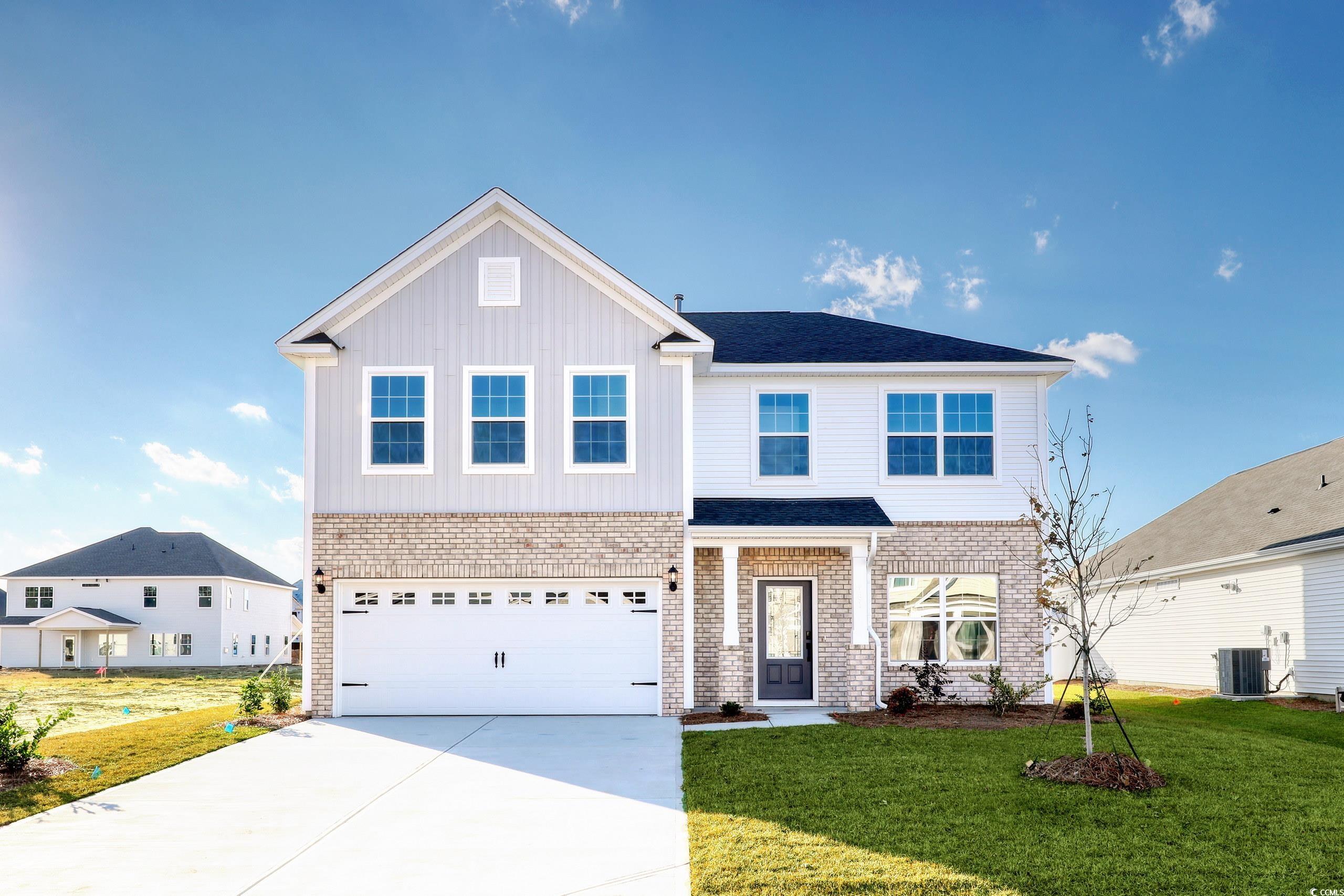 181 Azure Loop Myrtle Beach, SC 29588 - Photo 1 of 40 View of front of home featuring central AC, a gara