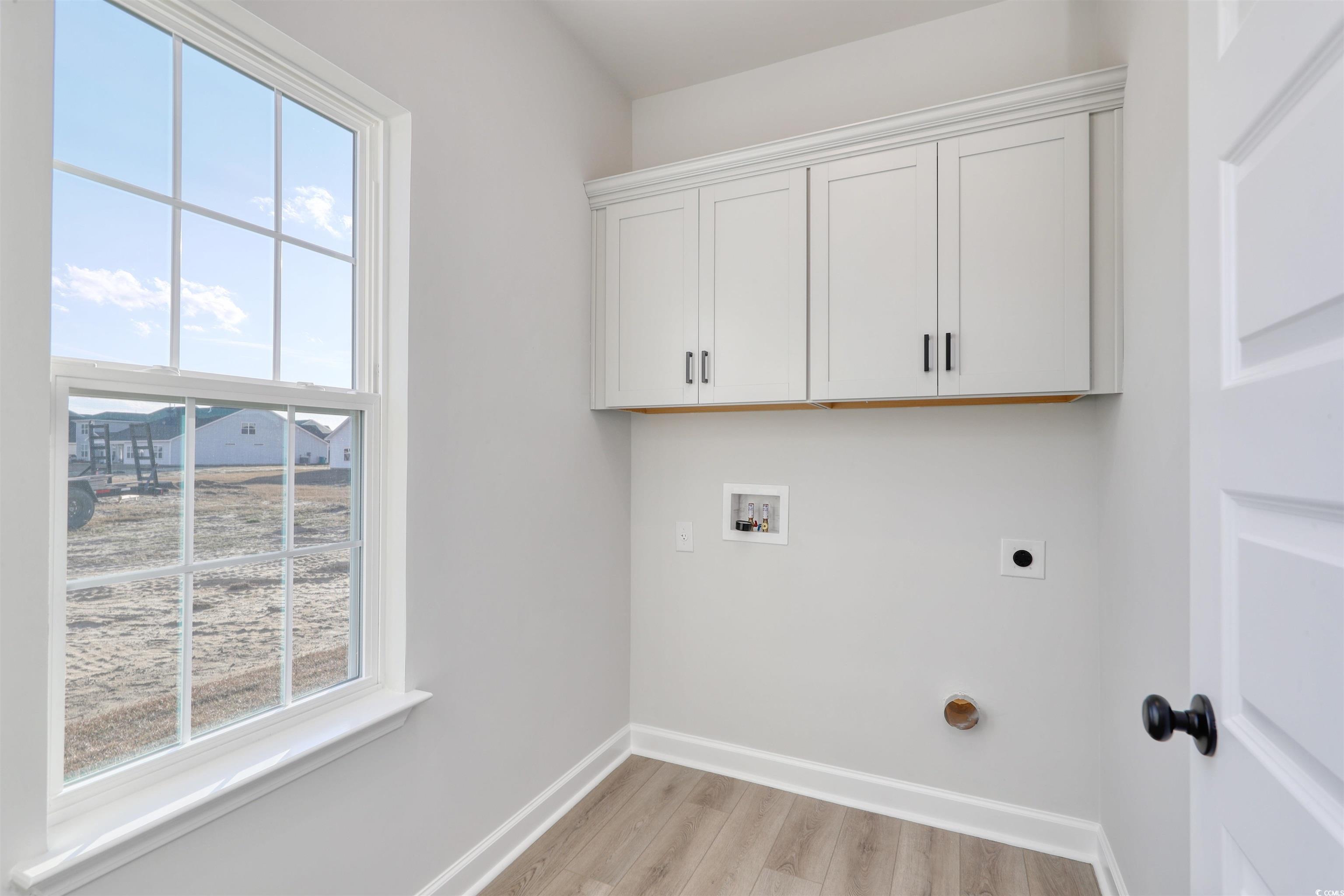 181 Azure Loop Myrtle Beach, SC 29588 - Photo 13 of 40 Laundry room with a healthy amount of sunlight, ho