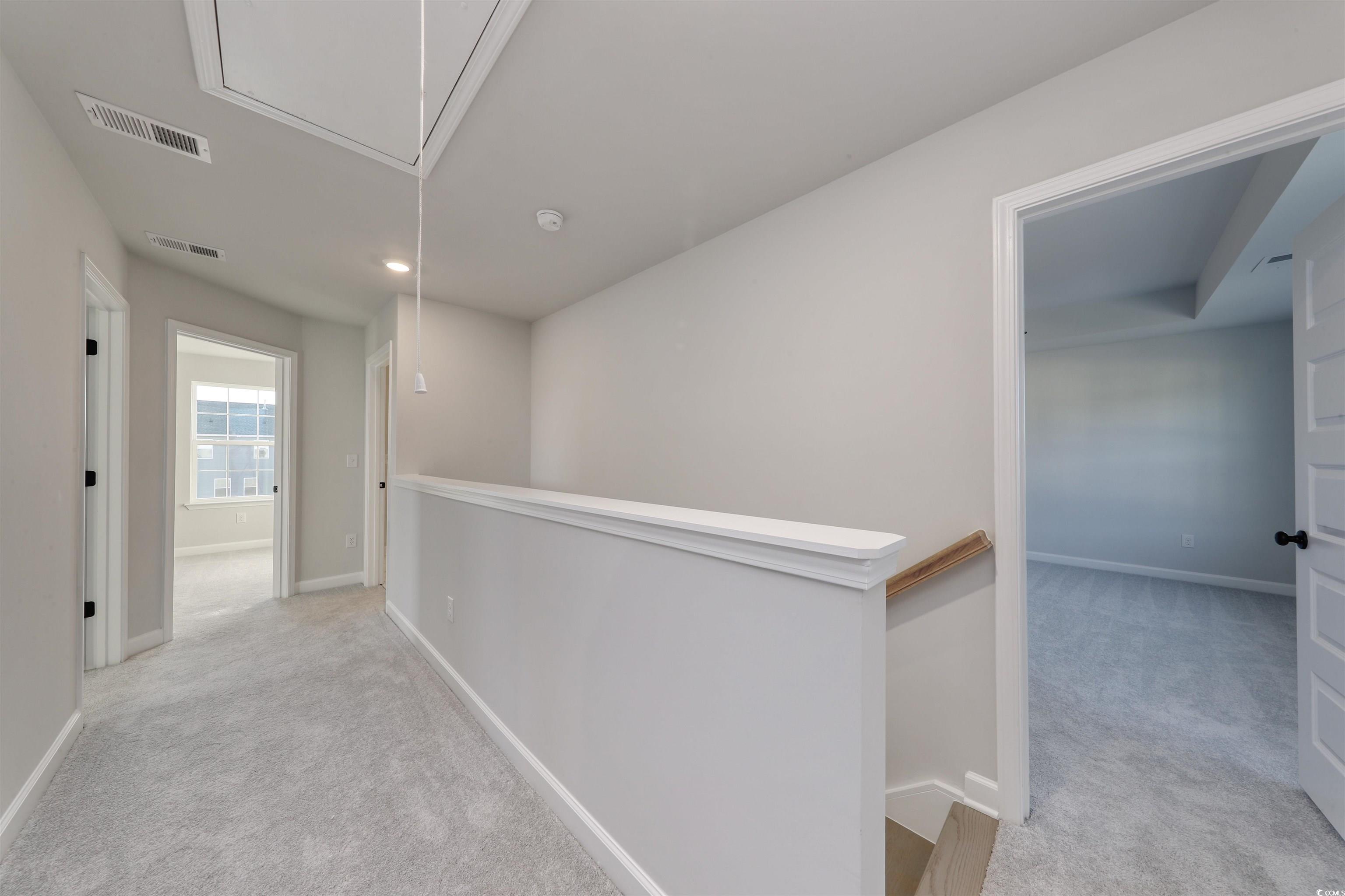 181 Azure Loop Myrtle Beach, SC 29588 - Photo 19 of 40 Corridor featuring light carpet