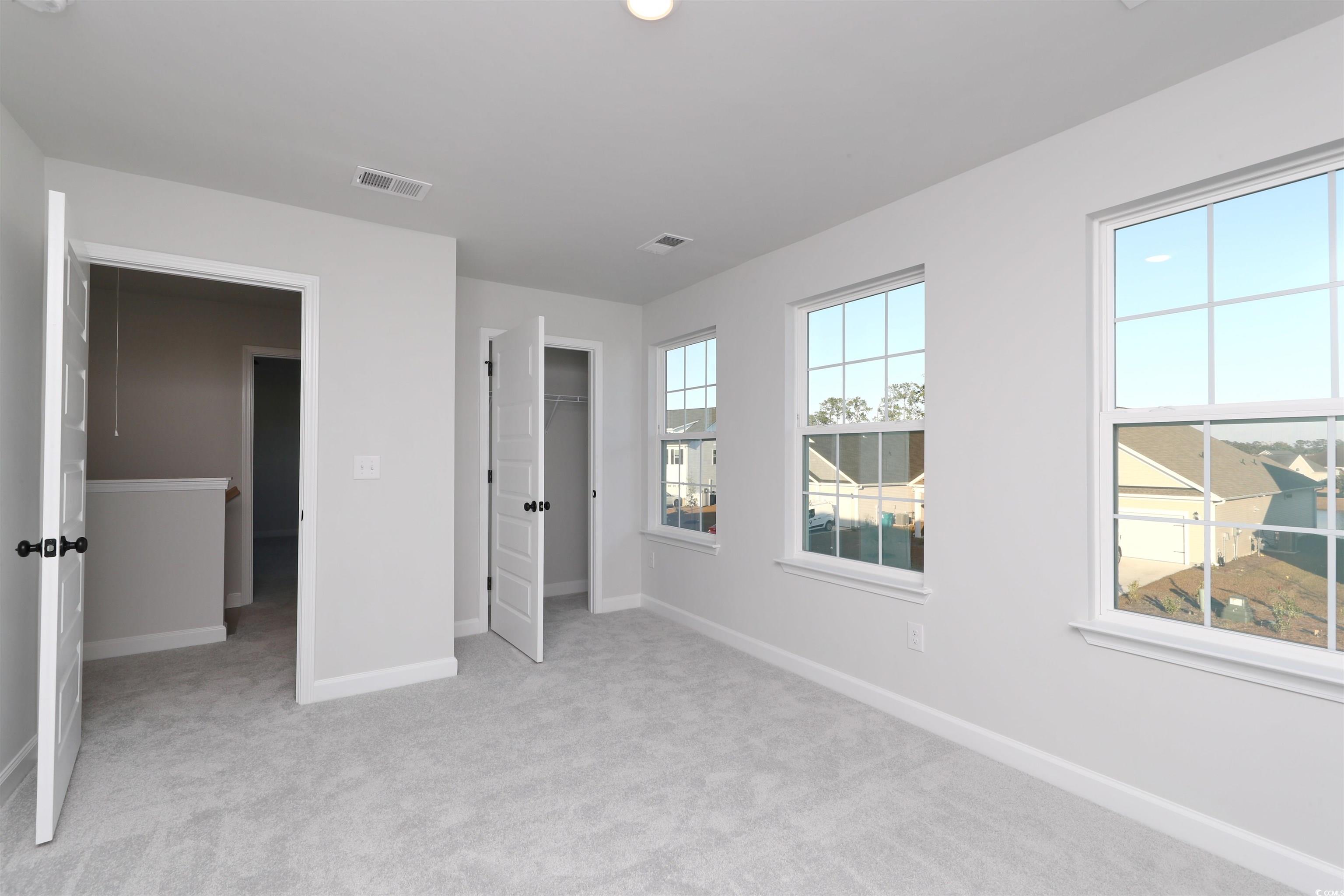 181 Azure Loop Myrtle Beach, SC 29588 - Photo 24 of 40 Unfurnished bedroom featuring light carpet and a c