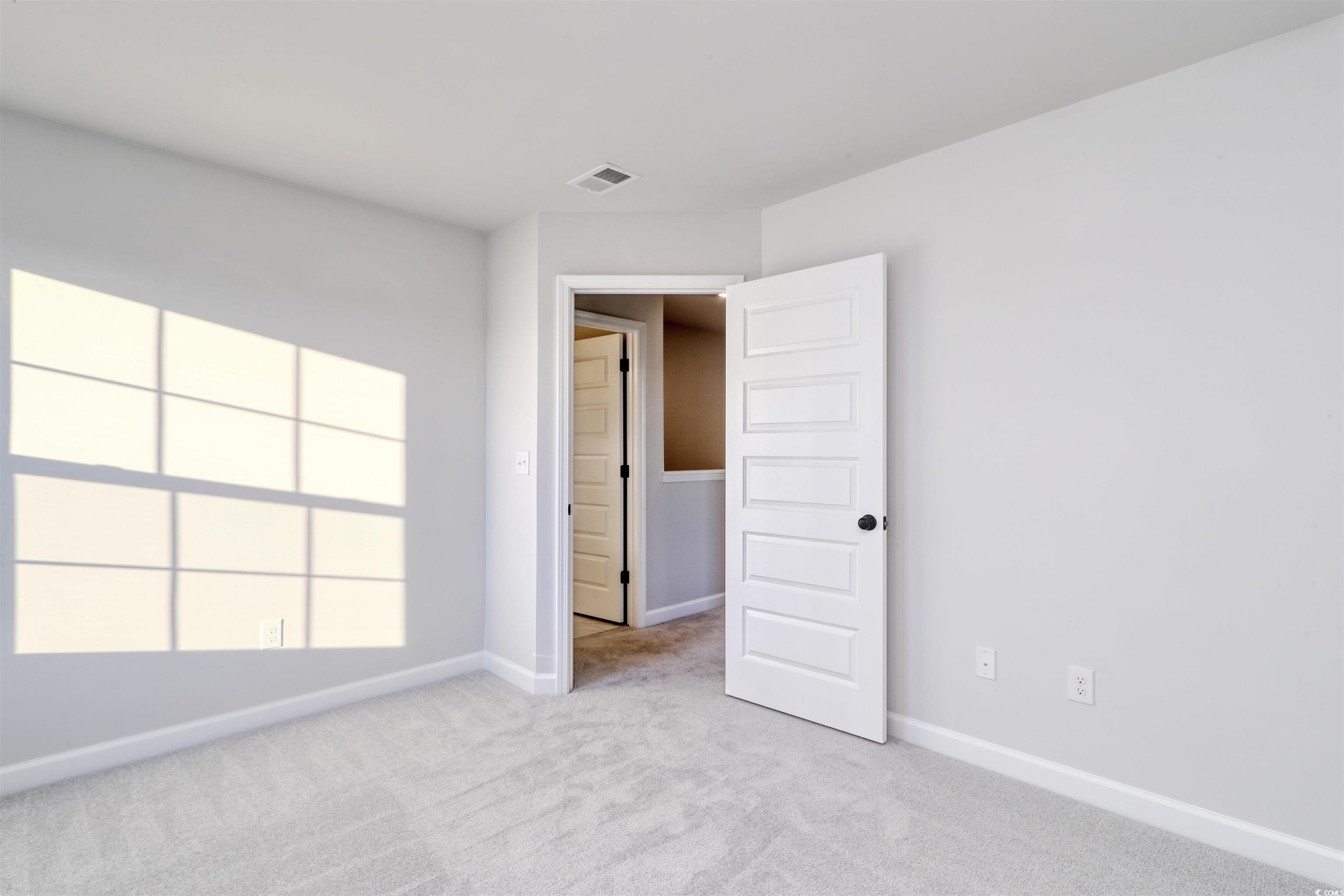 181 Azure Loop Myrtle Beach, SC 29588 - Photo 26 of 40 Unfurnished bedroom with light carpet