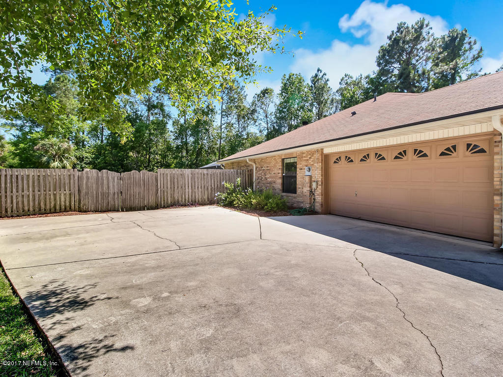 1875 Old Fleming Grove Road Fleming Island, FL 32003 - Photo 2 of 47 Side Entry Garage