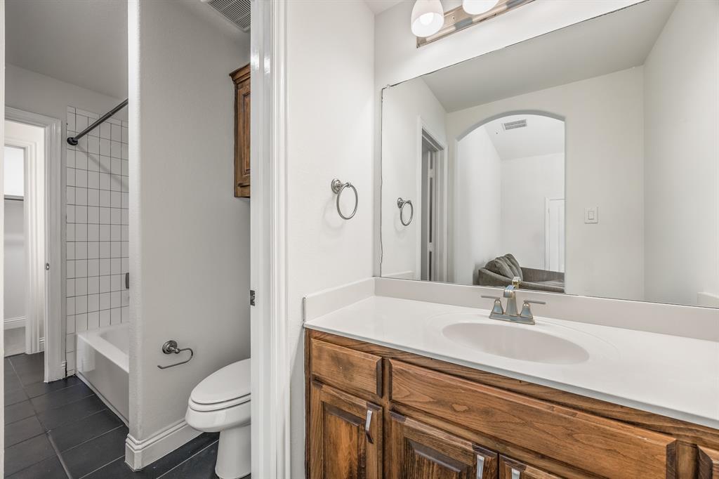 408 Piper Lane Fate, TX 75087 - Photo 36 of 40 Jack and Jill bathroom connecting bedrooms 3 and 4