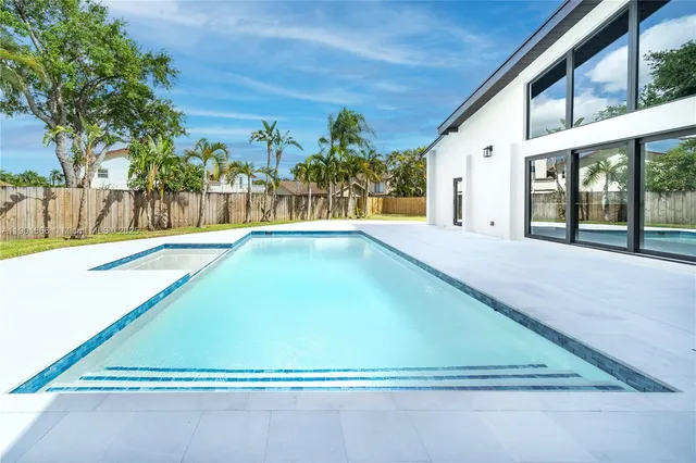 a view of swimming pool with outdoor seating