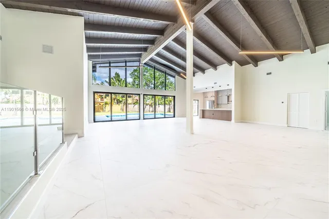 a view of a room with wooden walls