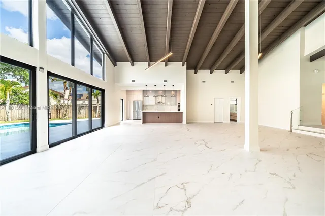 a kitchen with stainless steel appliances a refrigerator sink and cabinets