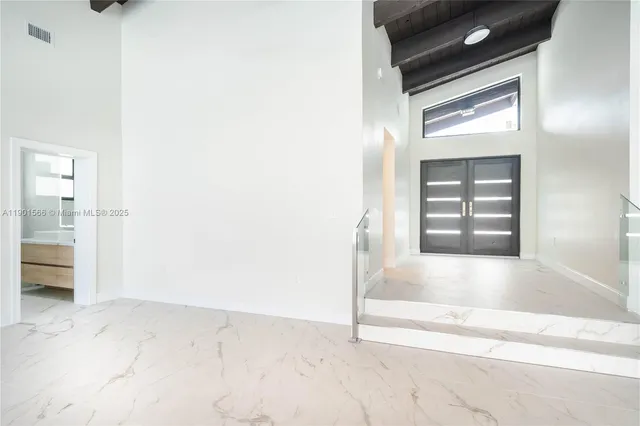 a view of a kitchen with a refrigerator