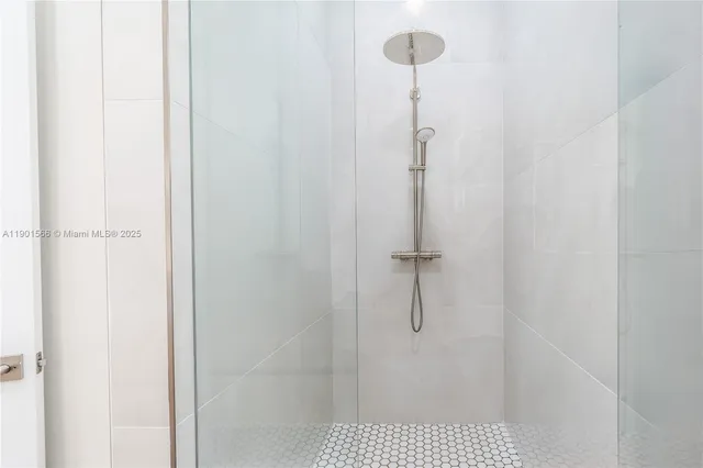 a view of hallway with furniture and a window