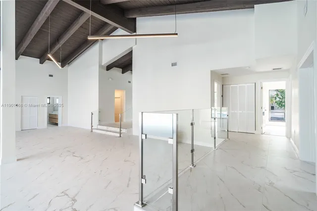 a bathroom with a sink a toilet a mirror and bathtub