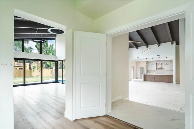 a view of room with wooden floor
