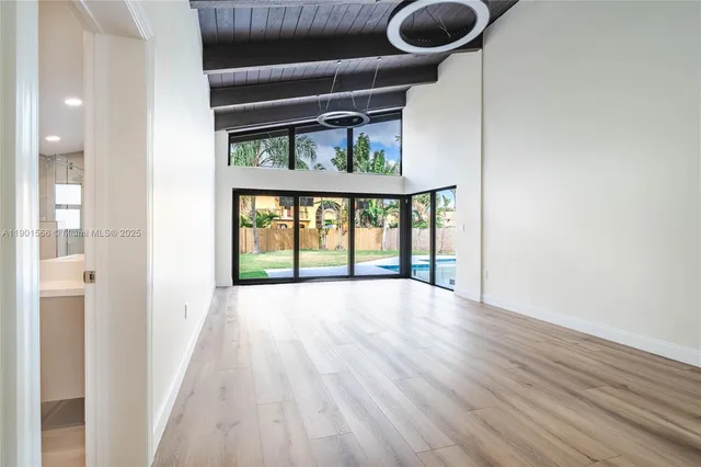 a spacious bathroom with a double vanity sink toilet and a mirror