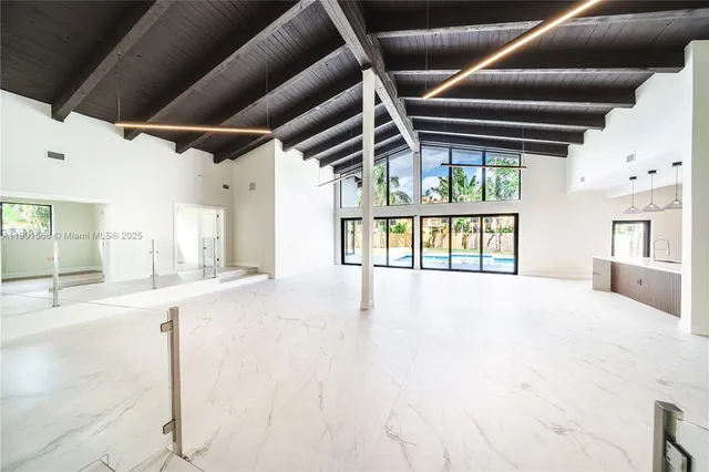 a view of an empty room with a utility room