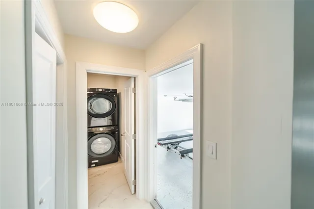 a view of an empty room with a floor to ceiling window and stairs